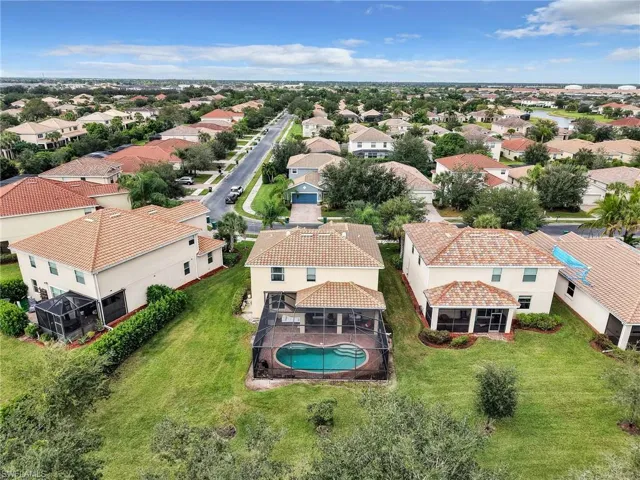Aerial view of residential area featuring a pool area