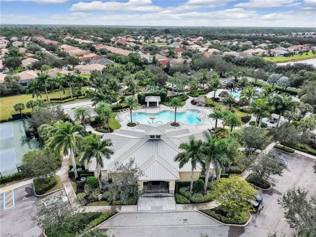 Aerial view of residential area featuring a pool