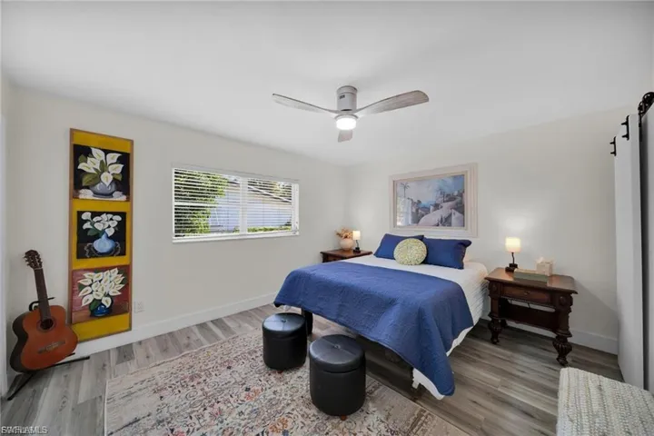 Bedroom with a contemporary ceiling fan and light fixture