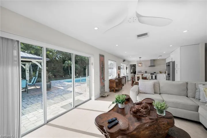 Open-concept interior featuring tiled flooring and recessed lighting