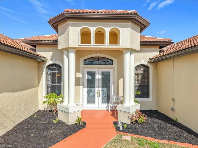 View of exterior entry featuring french doors