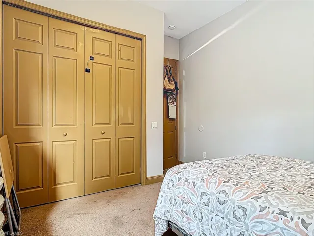 Bedroom featuring a closet and carpet floors