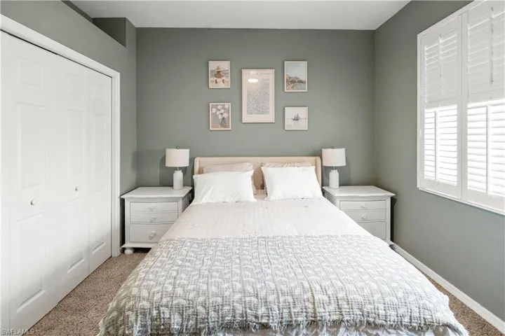 Bedroom with carpet flooring and a closet