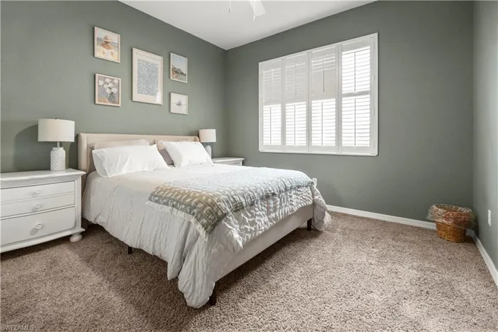 Bedroom featuring carpet floors and ceiling fan
