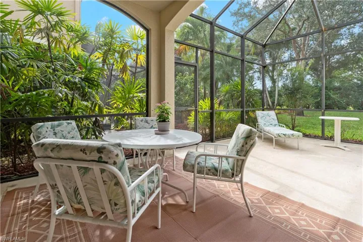 Sunroom with a patio and outdoor dining area