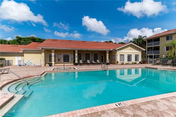 Community pool featuring a patio