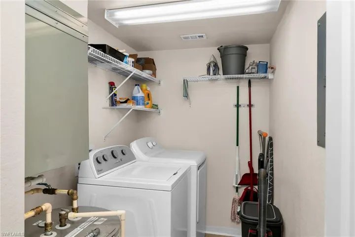 Laundry room featuring separate washer and dryer