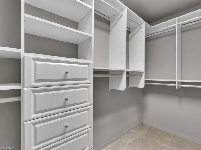 Custom Closet System In The Master Closets