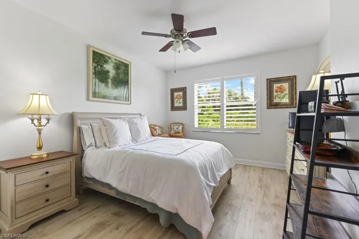 Bedroom with light hardwood / wood-style flooring and ceiling fan