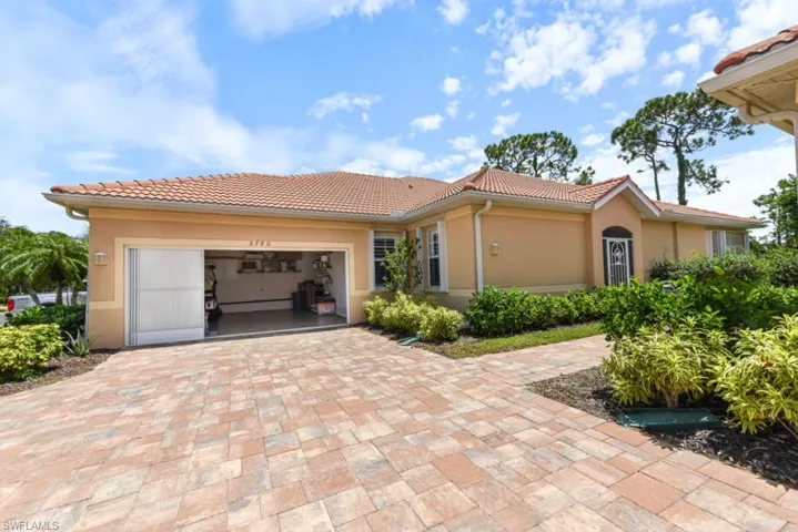 Mediterranean / spanish house featuring a garage