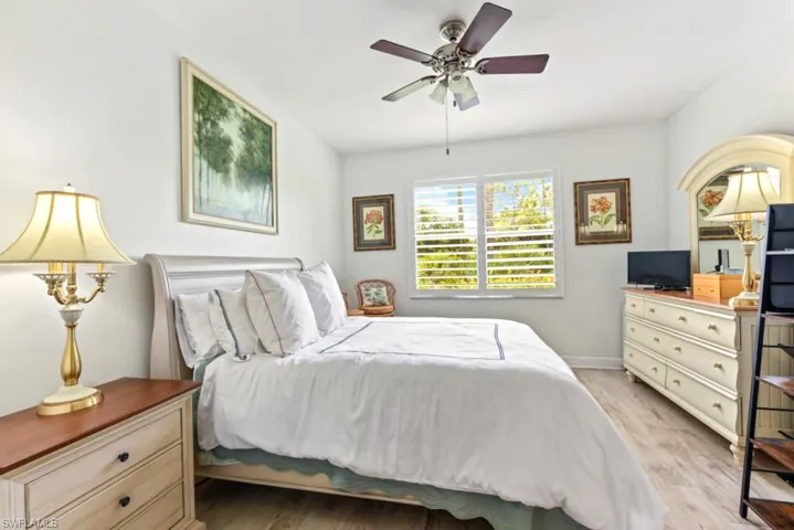 Bedroom featuring light hardwood / wood-style flooring and ceiling fan