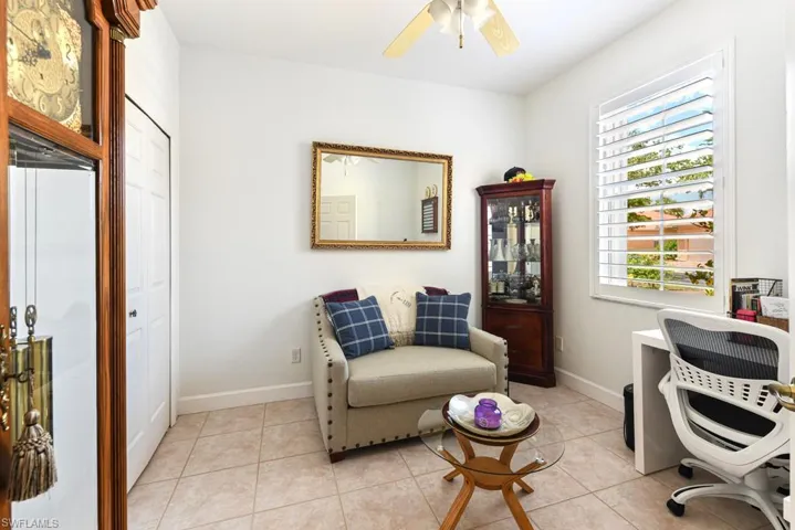 Tiled home office with ceiling fan