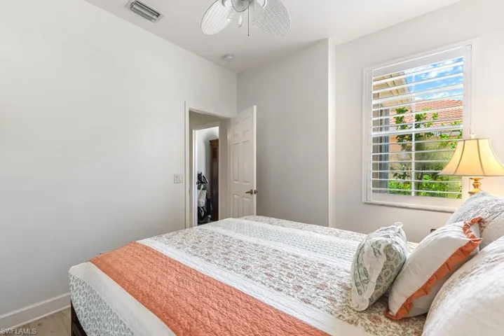 Bedroom featuring ceiling fan and hardwood / wood-style floors