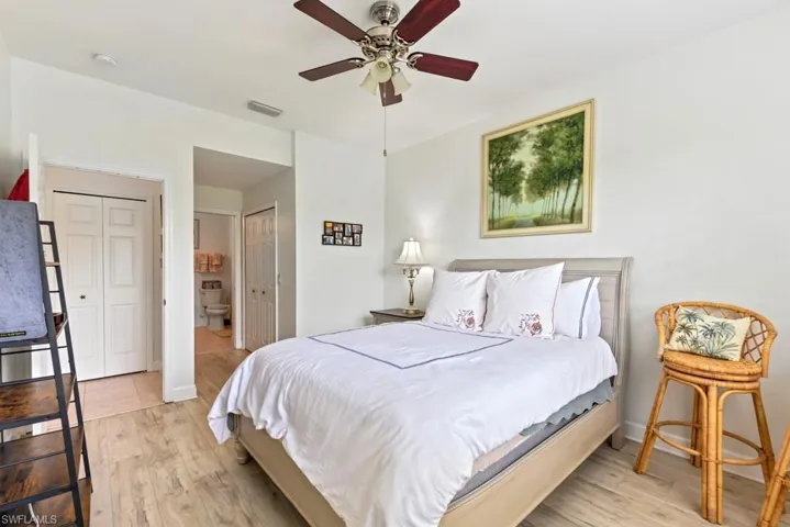 Bedroom with ceiling fan and light hardwood / wood-style floors