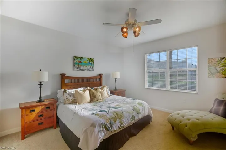 Bedroom with carpet floors and a ceiling fan