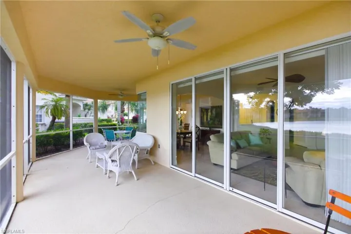 Sunroom / solarium with a ceiling fan