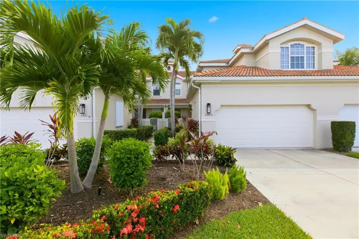 Mediterranean / spanish home featuring stucco siding, concrete driveway, and a tile roof