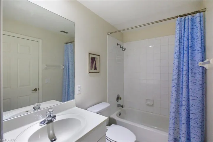 Bathroom with vanity and shower / tub combo