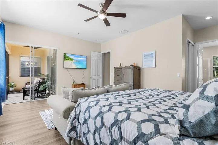 Bedroom featuring ceiling fan and light hardwood / wood-style floors