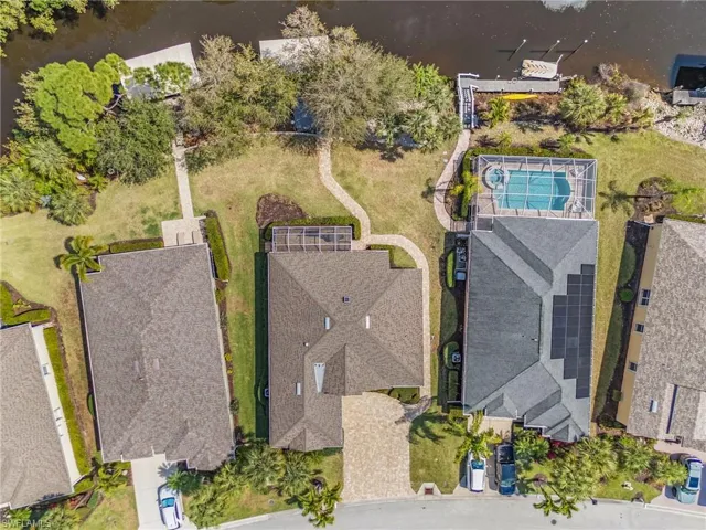 Aerial view of residential area featuring a large body of water