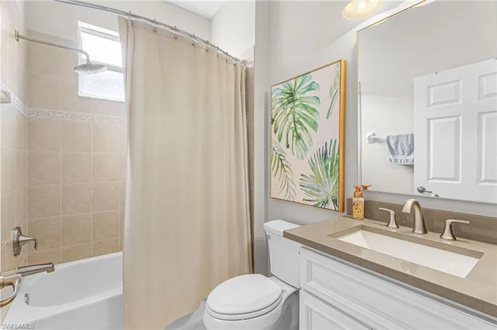 Full bathroom featuring vanity and shower / bath combo
