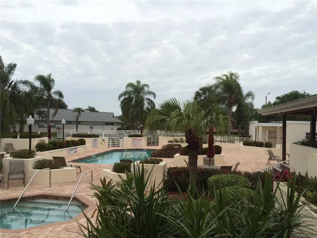 Community pool featuring a patio and a community hot tub