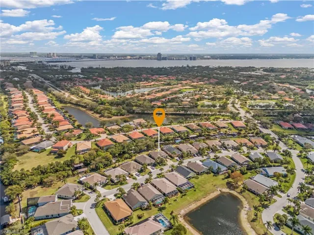 View of property location with a nearby body of water and nearby suburban area