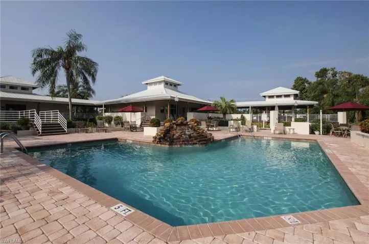 Community pool featuring a patio and a gazebo