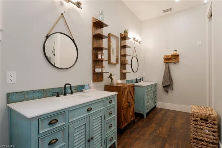 Bathroom with hardwood / wood-style floors and vanity