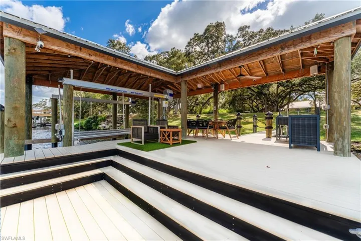 Large dock with ceiling fan, lift and outdoor kitchen