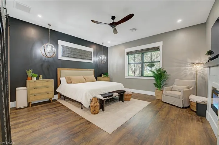 Bedroom featuring dark hardwood / wood-style flooring and ceiling fan