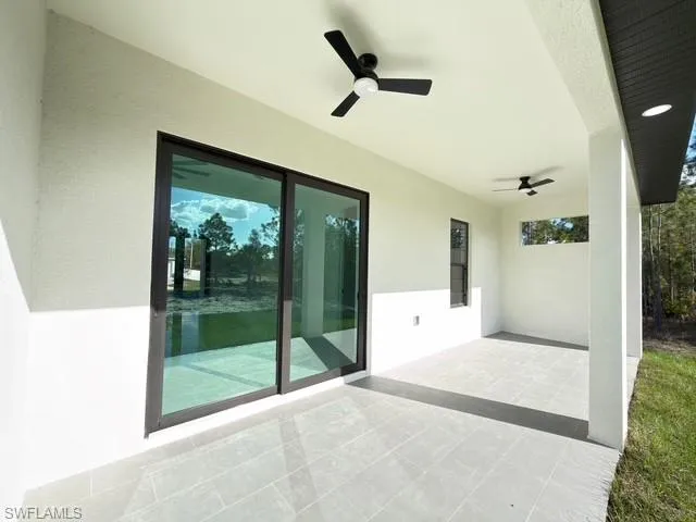 View of patio featuring a ceiling fan