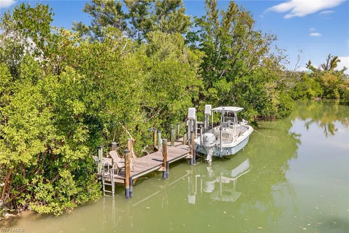 Dock area with a water view. Bay access canal