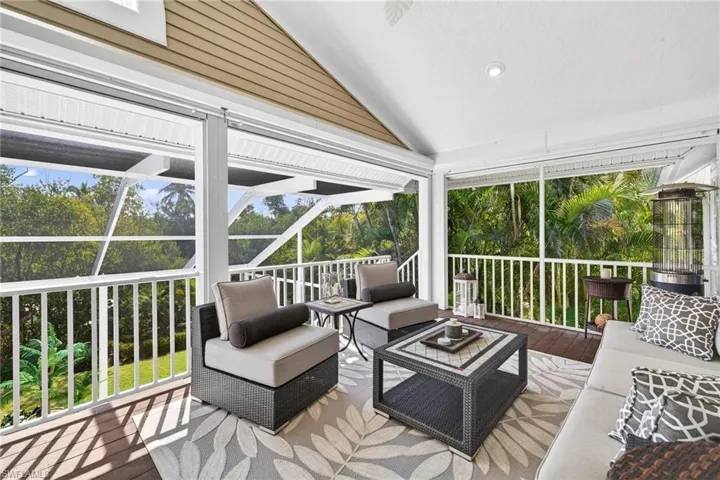 Sunroom / solarium featuring outdoor lounge area and lofted ceiling