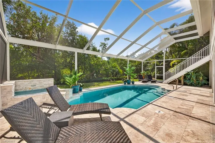 Swimming pool with a sunroom, a patio