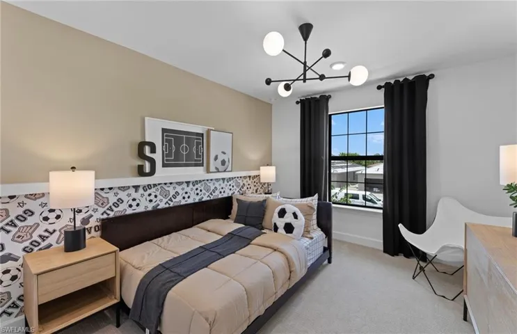 Bedroom with light carpet and baseboards