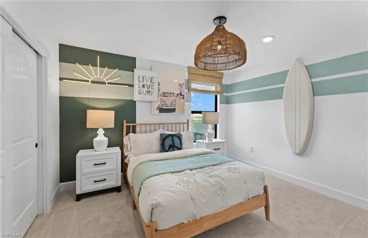 Bedroom with a closet, light carpet, and recessed lighting