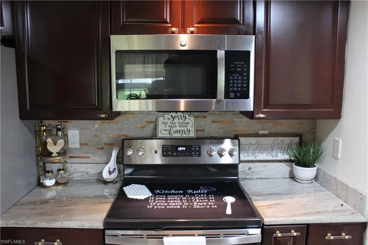 Stainless steel microwave and stove less than 1 year old