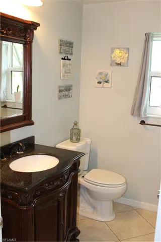 Guest bathroom with vanity and linen closet