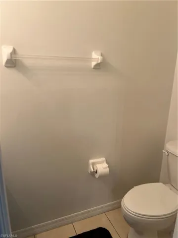 Bathroom featuring toilet and tile patterned floors