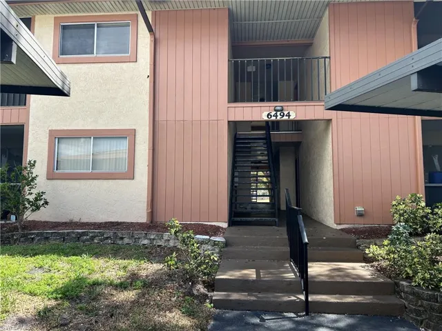 Property entrance featuring stucco siding