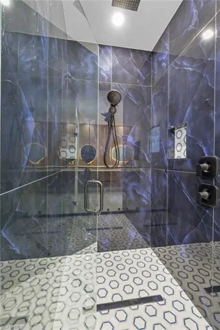 Bathroom featuring a shower with shower door