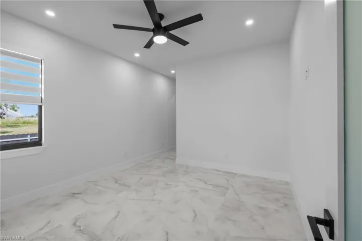 Unfurnished room with ceiling fan