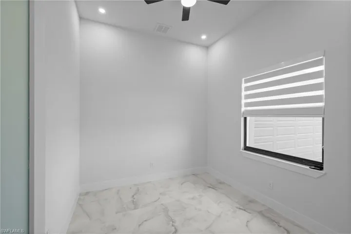 Unfurnished room with ceiling fan