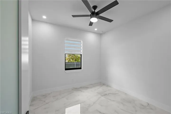 Unfurnished room featuring ceiling fan