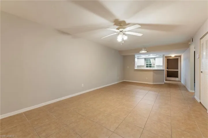 28330 Pine Haven Way Unit 67 Bonita Springs FL 34135 - Living and dining areas from slider