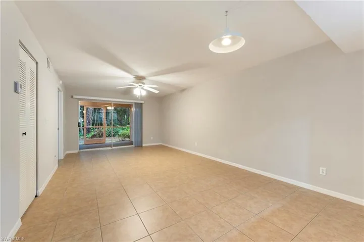 28330 Pine Haven Way Unit 67 Bonita Springs FL 34135 - Fully tiled living, dining, and bedroom