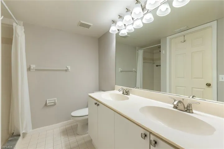 28330 Pine Haven Way Unit 67 Bonita Springs FL 34135 - Owner's bath with dual sinks and shower