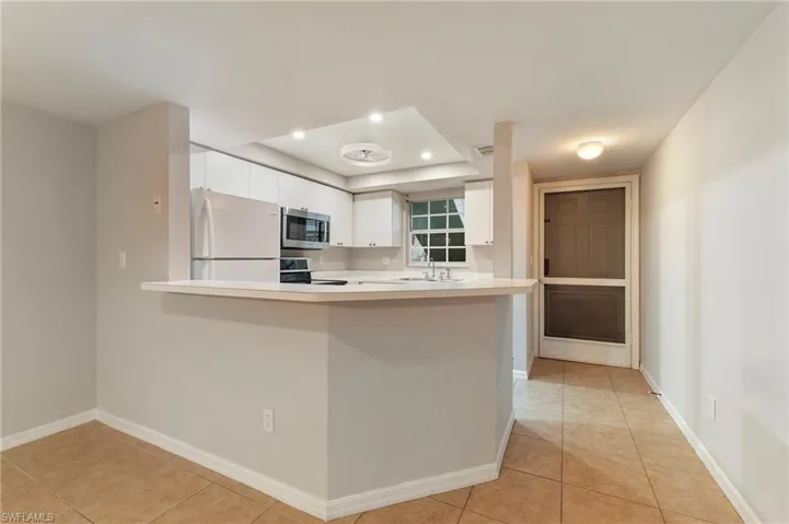 28330 Pine Haven Way Unit 67 Bonita Springs FL 34135 -Screened entry door lets you capture the SWFL breezes