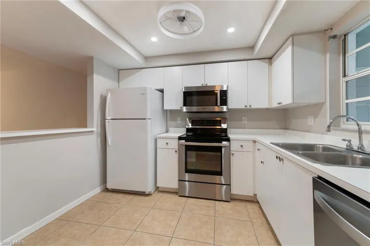 28330 Pine Haven Way Unit 67 Bonita Springs FL 34135- Sunny white kitchen with stainless appliances